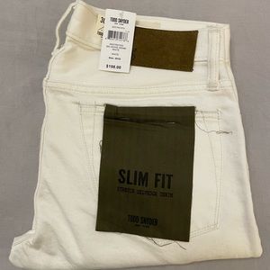 Todd Snyder distressed white denim five pocket jeans